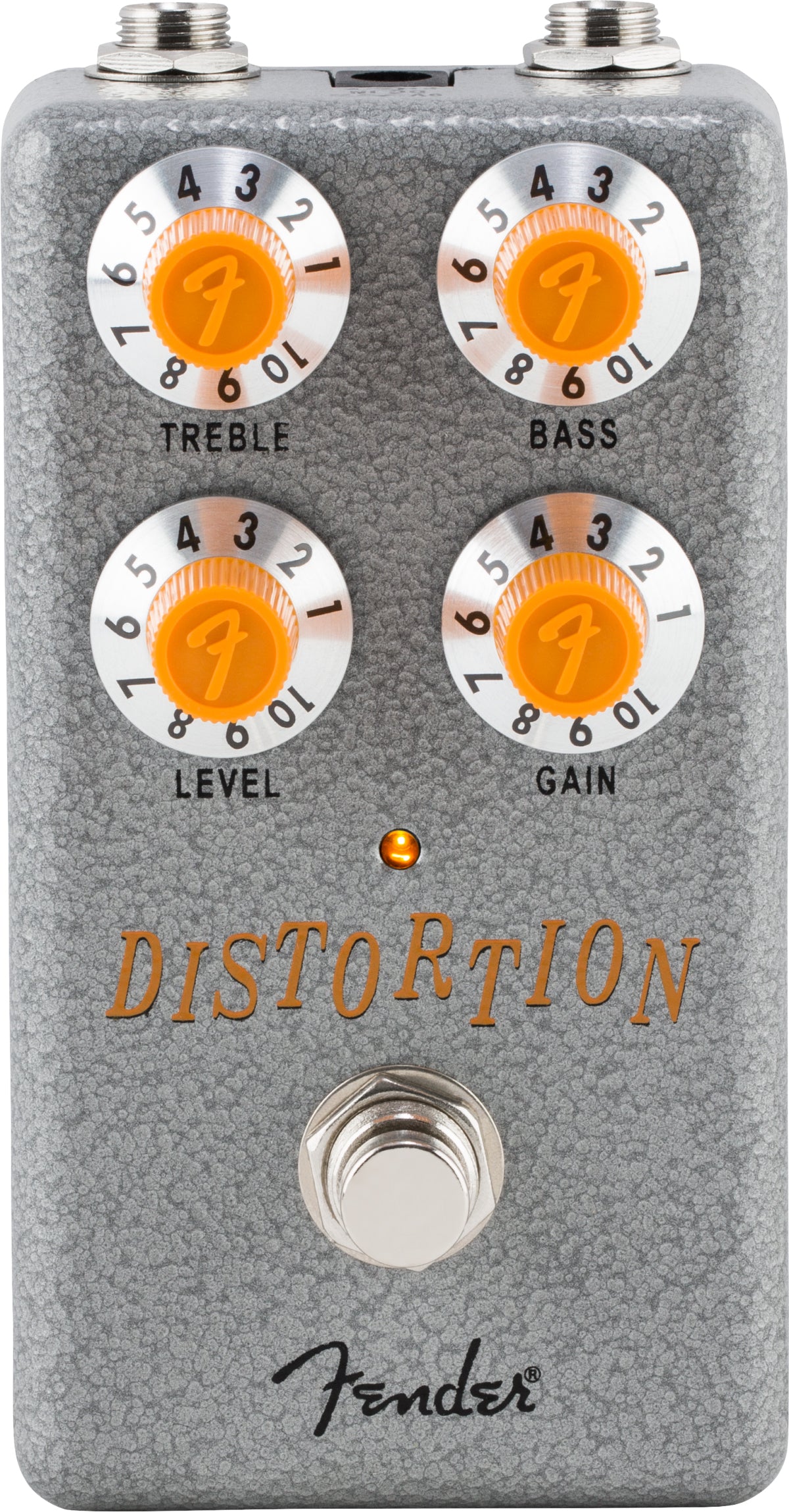 The image shows a Fender distortion pedal with a gray textured metal casing and four orange knobs labeled Treble, Bass, Level, and Gain, each numbered 0-10 and featuring the Fender "F" logo. It includes input/output jacks, a footswitch, an LED indicator, and the Fender script logo. This pedal modifies electric guitar sound by adding distortion and overdrive effects.