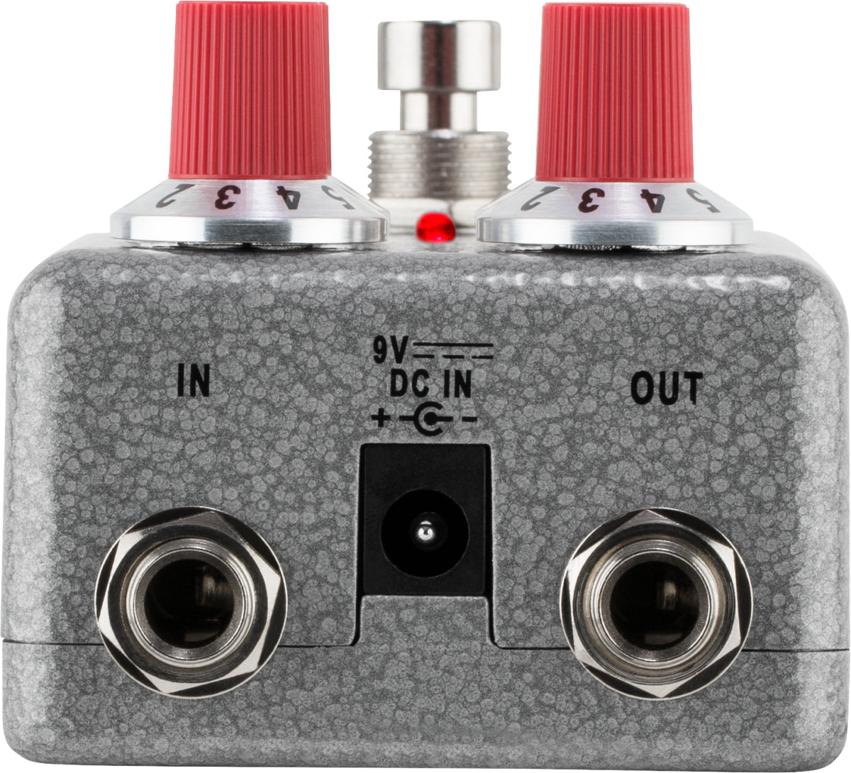 The image shows a guitar effects pedal, likely a distortion or overdrive type, with two red-topped control knobs, a central footswitch, input/output jacks labeled "IN" and "OUT," a 9V DC power input, a small red LED indicator, and a textured gray/silver metal casing. This pedal modifies electric guitar sound by adding distortion or overdrive between the guitar and amplifier.
