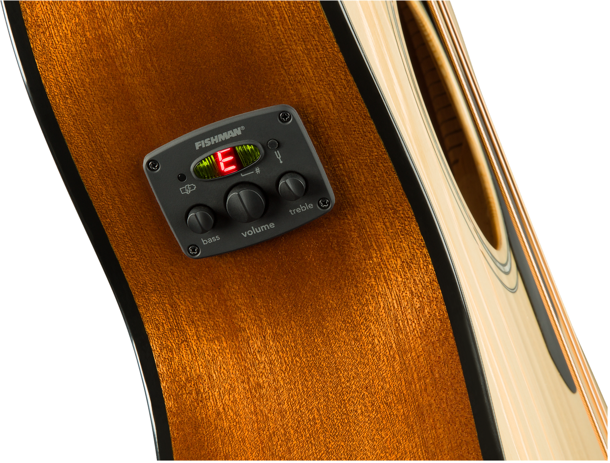 The image shows a close-up of an acoustic guitar’s side featuring a Fishman preamp/EQ system. It includes a digital tuner displaying "E," three control knobs labeled bass, volume, and treble, and the Fishman logo. The guitar has a rich amber wood grain with natural binding. This electronic setup enables amplification while preserving the acoustic tone and offers on-board tuning, ideal for live performance and recording.