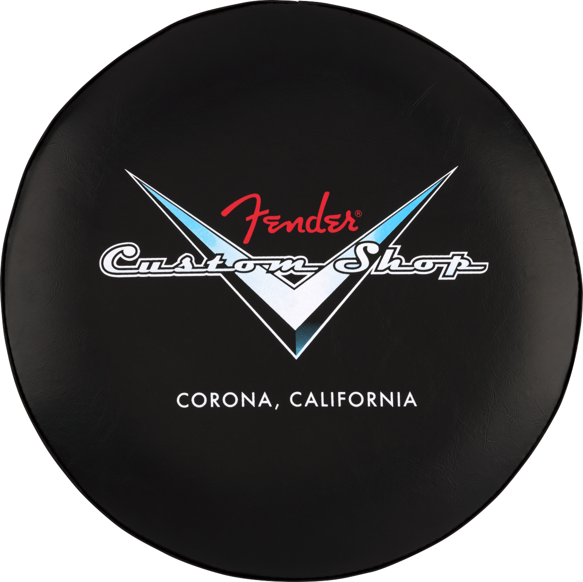 The image shows a circular black stool top featuring the Fender Custom Shop logo. The logo includes the red Fender script above white "Custom Shop" text within a V-shaped design with blue and white accents. Below, it reads "CORONA, CALIFORNIA," referencing Fender’s Custom Shop location. This branded seat likely suits music stores, guitar shops, or studios, appealing to Fender fans and guitar enthusiasts.