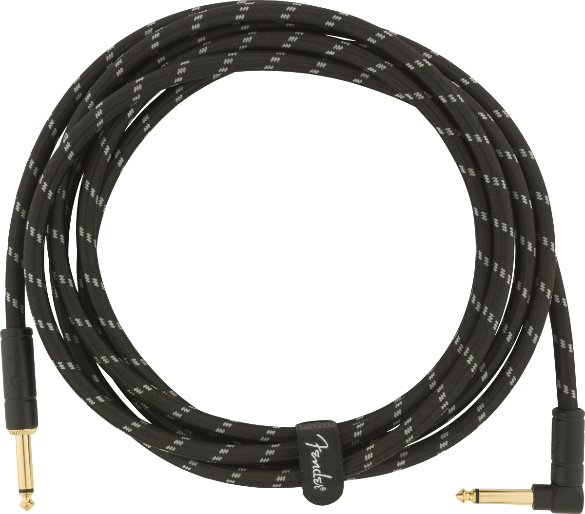 The image shows a coiled musical instrument cable with a black braided exterior featuring a white zigzag pattern. It has gold-plated 1/4" TS connectors—one straight and one right-angle. A cable tie with the "Fender" logo secures it. Designed for electric guitars, basses, and other instruments, the durable braided jacket and gold connectors ensure reliable performance and corrosion resistance.