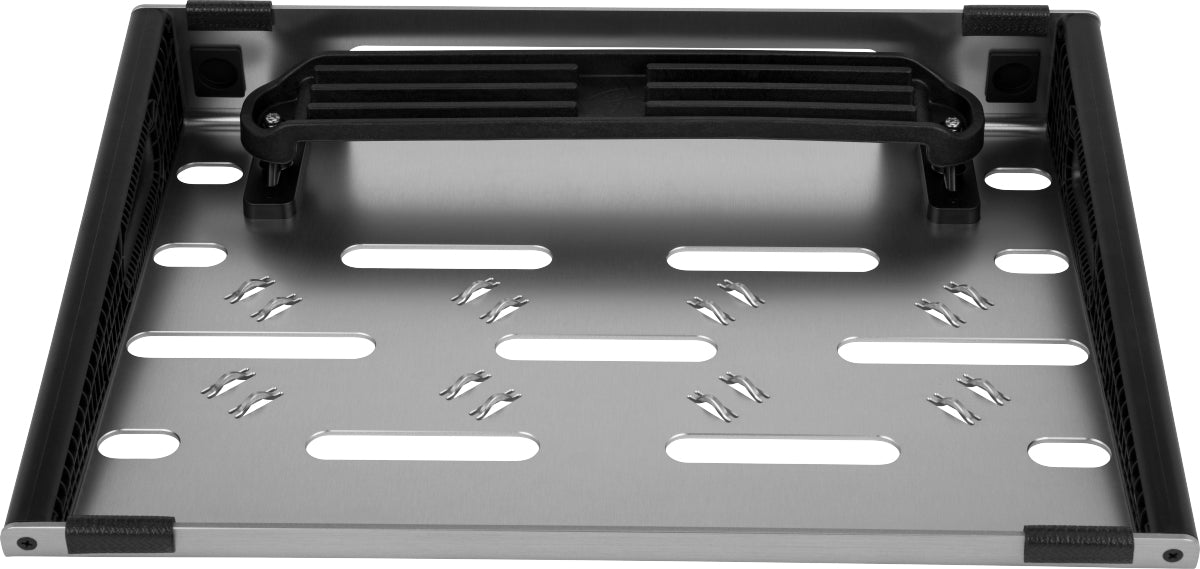 The image shows a metal pedalboard frame with a silver perforated surface for mounting guitar effects pedals. It features black textured side rails with velcro strips to secure pedals, a carrying handle for portability, and a sturdy rectangular design. This professional pedalboard helps musicians organize, power, and transport their effects pedals with clean cable management and easy setup.