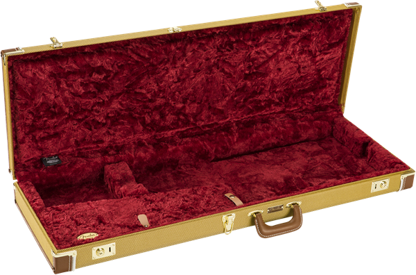 The image shows a hard shell guitar case with a tan tweed exterior, gold metal hardware, and a brown leather handle. It has a deep red plush velvet interior with custom-molded foam compartments to securely hold an electric guitar. The case features multiple latches for secure closure, providing sturdy protection and safe transport for musicians.