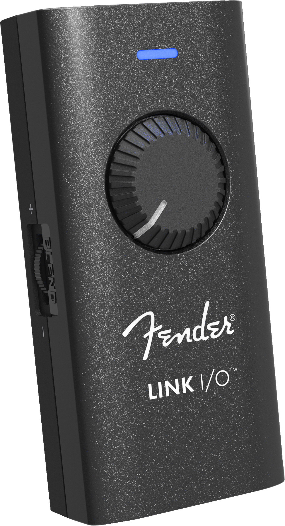 The image shows a Fender LINK I/O audio interface, a compact, portable device for connecting guitars or basses to computers, tablets, or smartphones. It features a black textured housing with the white Fender logo, a large central rotary knob, a blue LED indicator, and multiple side ports for inputs and outputs. Designed for recording, practice, and music production, it enables seamless integration with digital audio workstations and amp simulation software.
