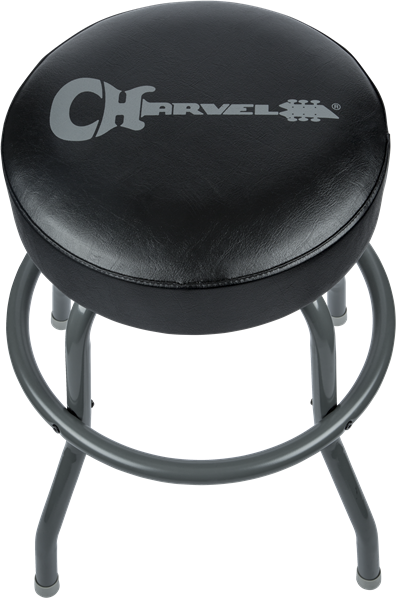 The image shows a black padded musician’s stool with a circular seat on four metal legs. The seat features the Charvel logo on its vinyl or leather surface. This adjustable-height stool, commonly used by guitarists, drummers, and keyboardists, offers comfort for long sessions. As branded Charvel merchandise, it complements their electric guitar products and fits a music room’s aesthetic.