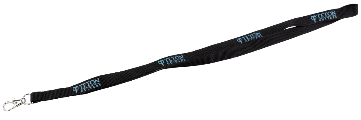 The image shows a black lanyard with "TETON GUITARS" repeated in blue text along its length. It features a metal clip at one end and serves as a promotional item from Teton Guitars, a guitar manufacturer. Commonly used to hold keys or ID badges, this lanyard helps promote the brand among musicians and guitar enthusiasts.