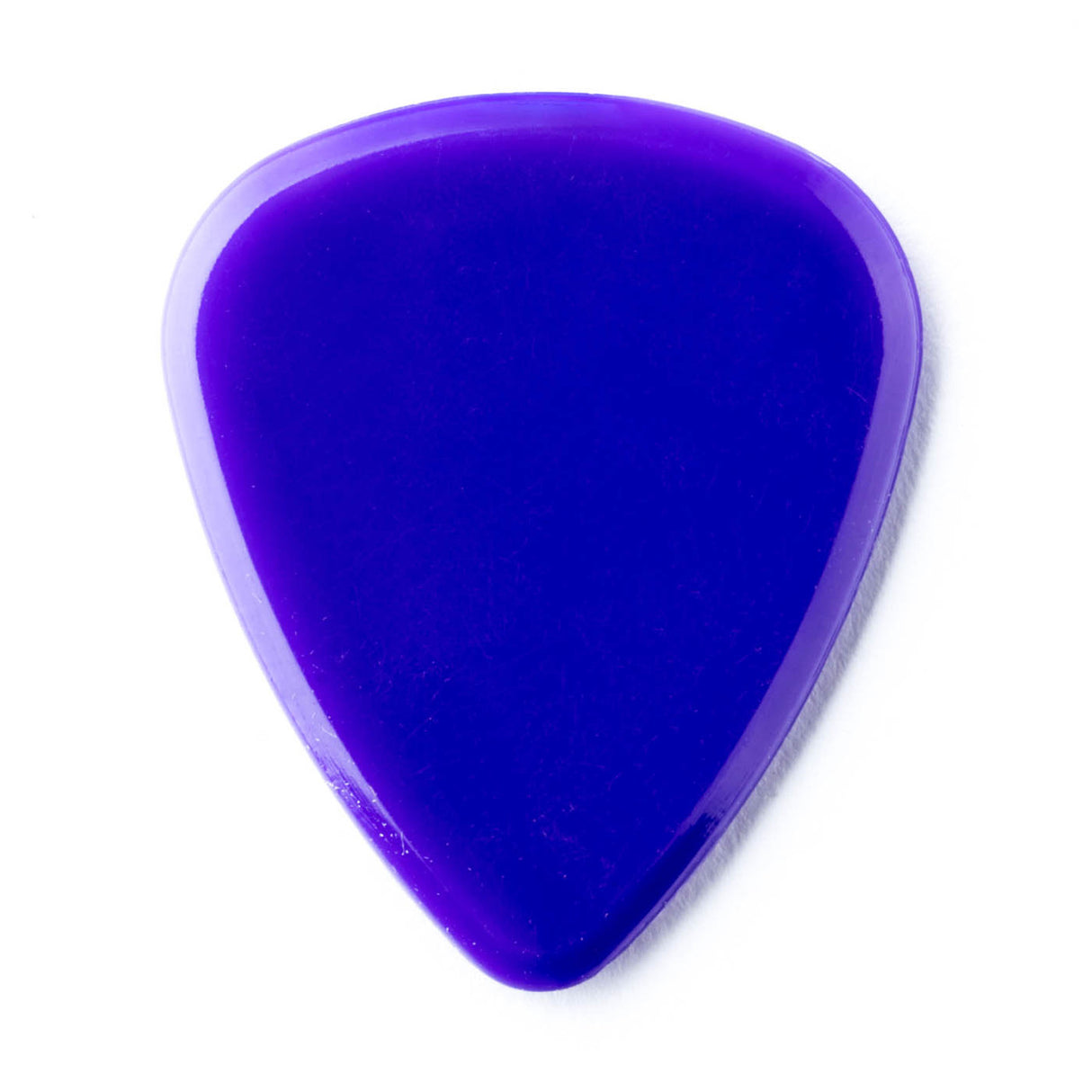 A purple guitar pick on a white background