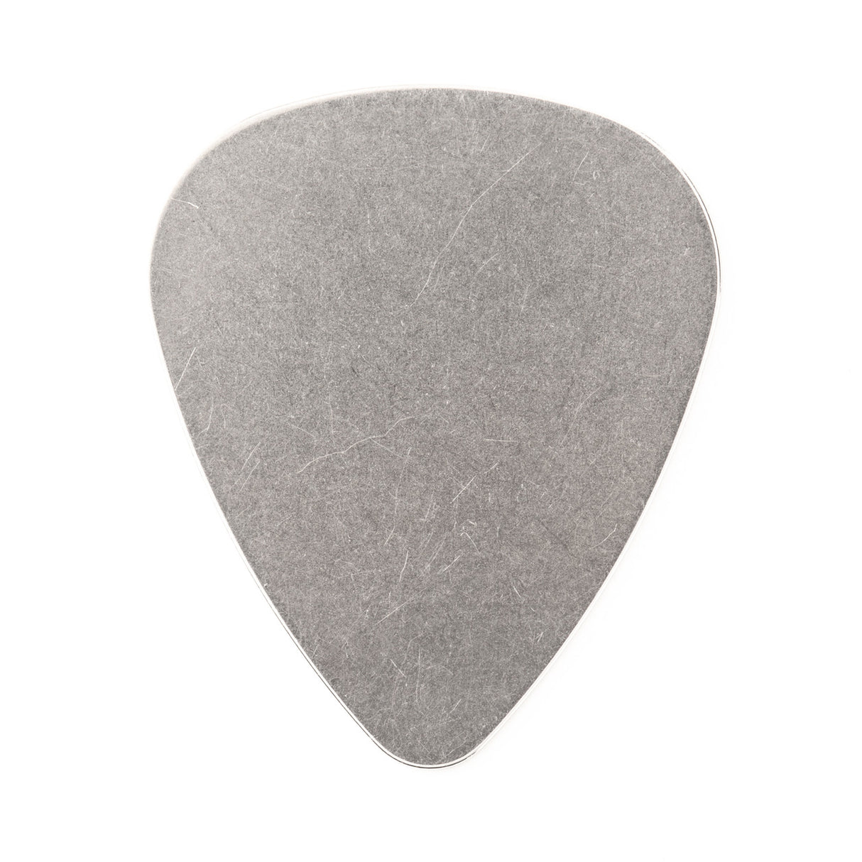 A stainless steel guitar pick on a white background