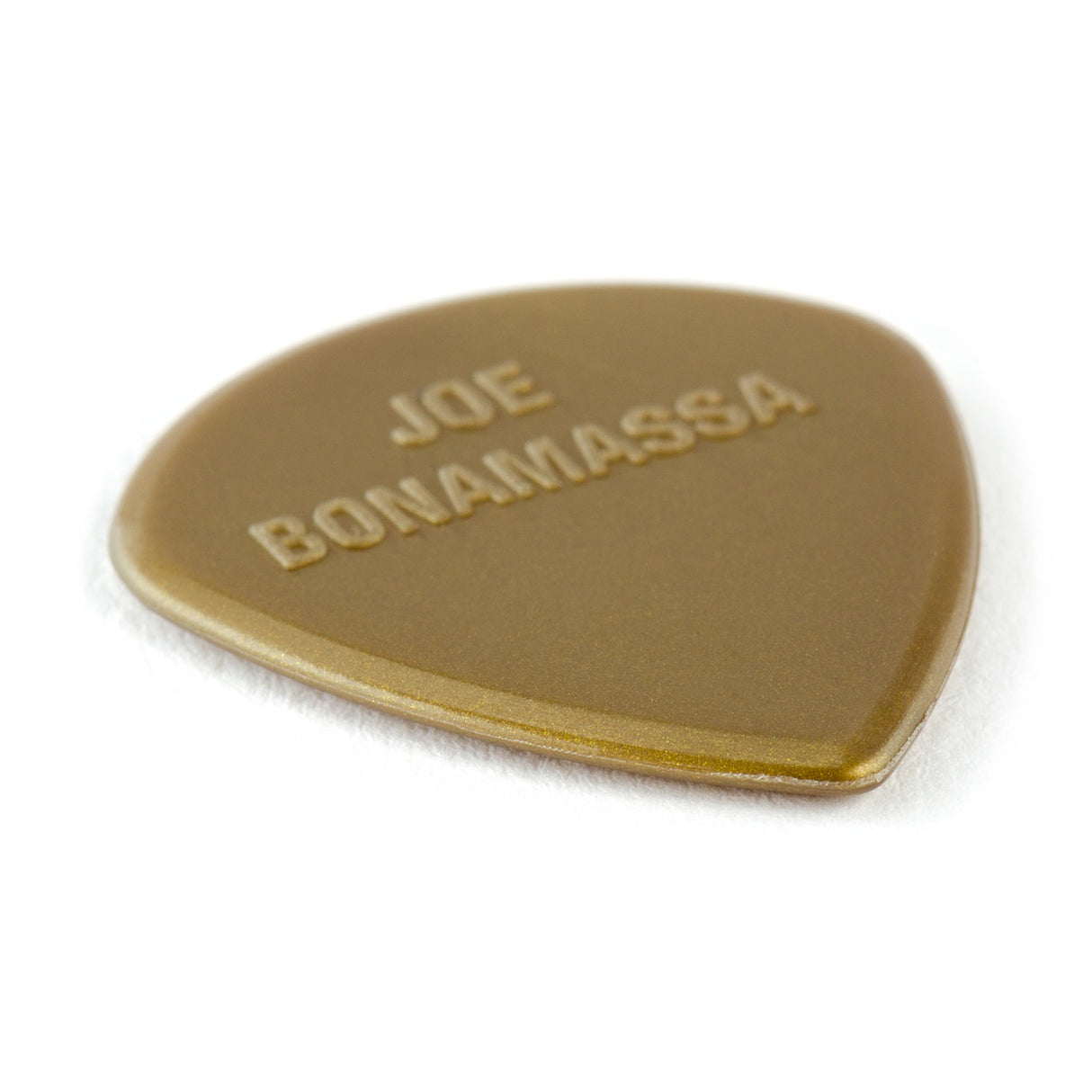 Gold guitar pick with 'Joe Bonamassa' engraving on a white background