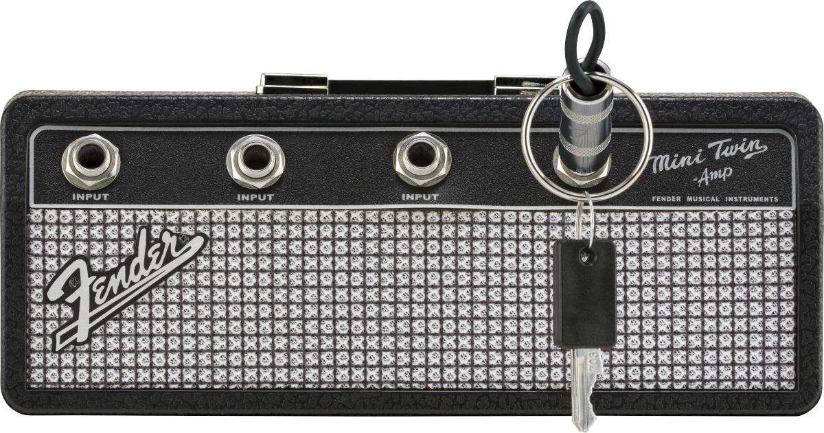 The image shows a compact Fender Mini Twin Amp keychain styled like a miniature guitar amplifier head. It features the Fender logo, “Mini Twin Amp” text, three 1/4" input jacks labeled "INPUT," and classic Fender design with silver sparkle grille and black tolex. This small, portable item resembles Fender’s Twin Reverb amps and is often used as a collectible, practice tool, or novelty accessory.