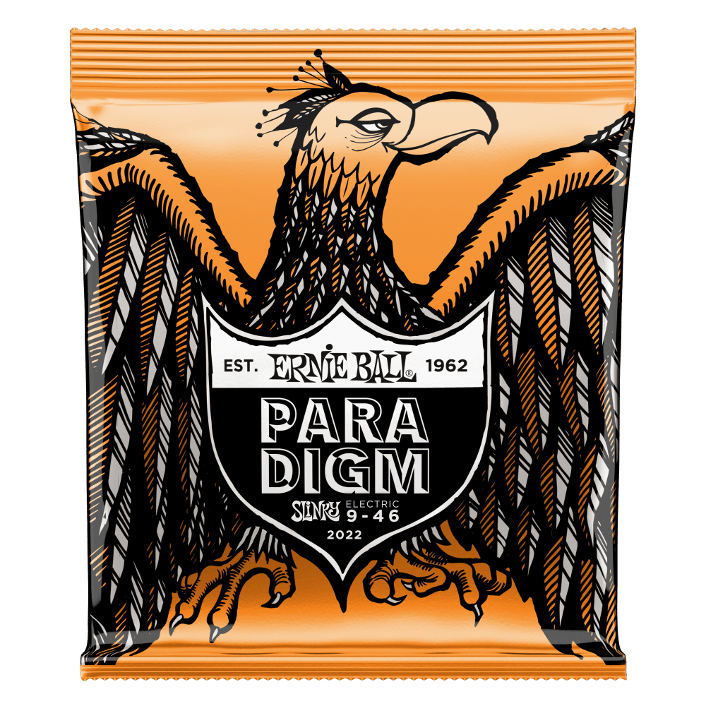 A package of Ernie Ball Paradigm guitar strings with Eagle artwork on an orange background
