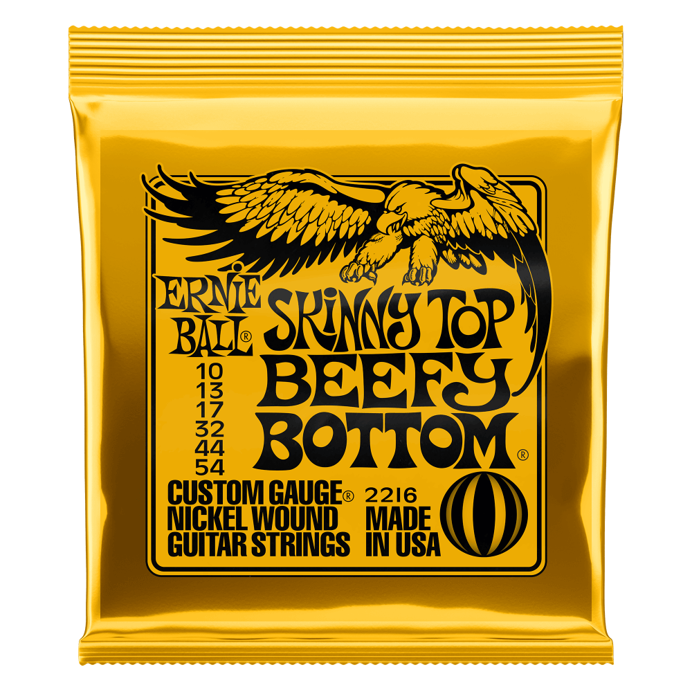 Ernie Ball Skinny Top Beefy Bottom guitar strings gold packaging on a white background