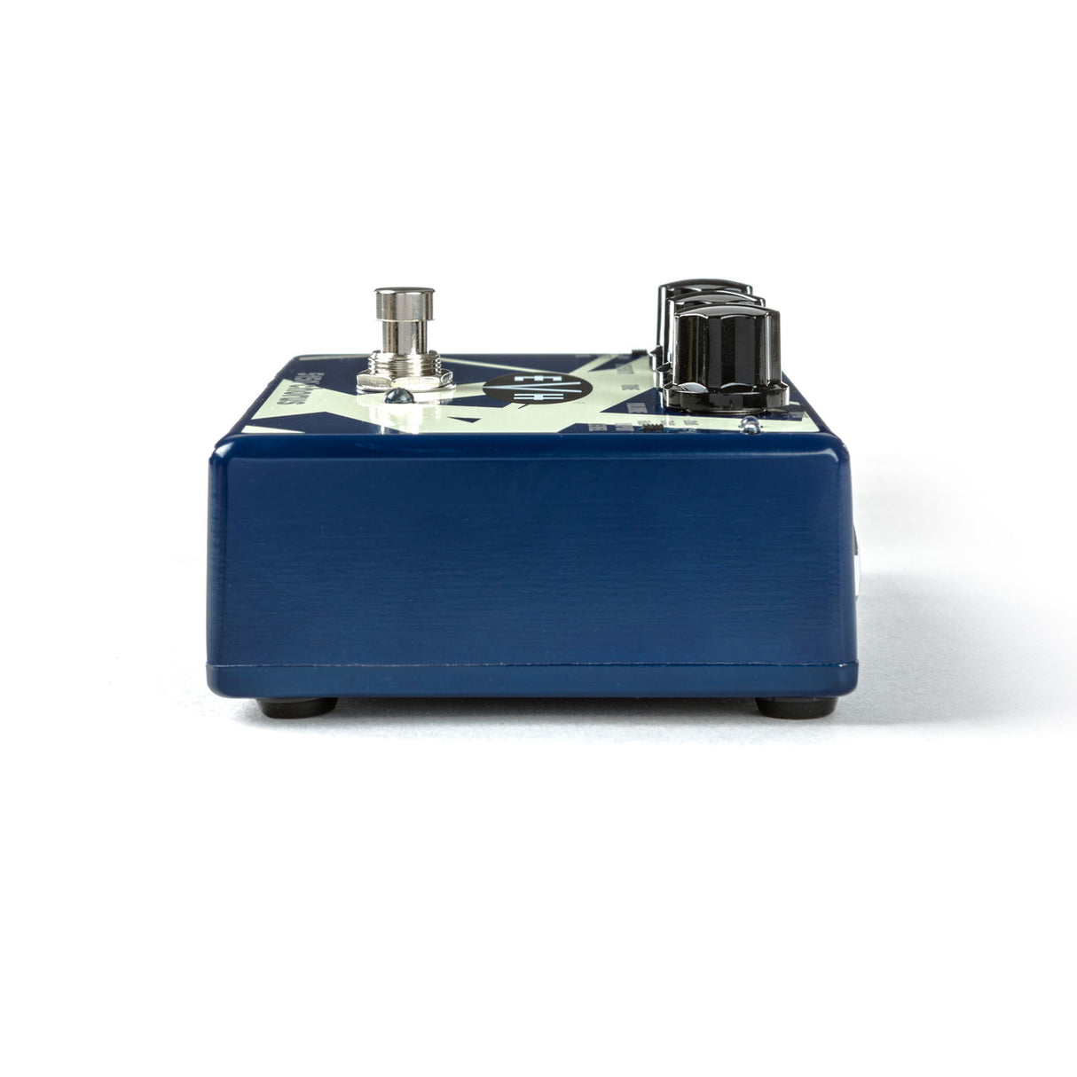 The image shows a guitar effects pedal, likely a distortion or overdrive type, with a dark blue metal housing and an off-white top panel. It features two control knobs on the right, an input/output jack on the left, and a central footswitch button to activate the effect. These pedals modify a guitar's sound and are used on the floor for easy activation during performances or recording.