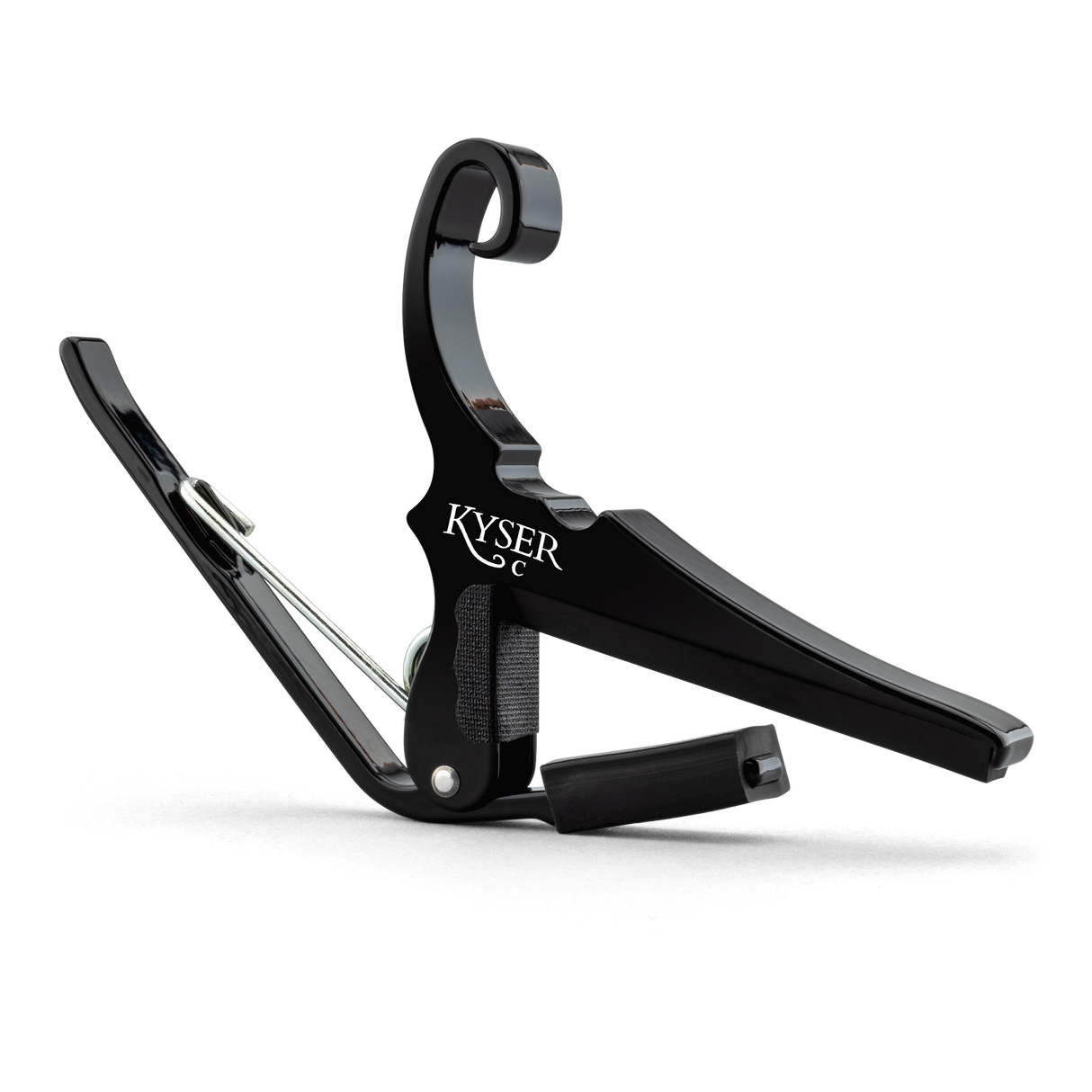 The image shows a Kyser Quick-Change guitar capo with a black finish and spring-loaded, curved arms. The "KYSER" branding is visible on its C-shaped clamp, designed for quick release and easy movement along the fretboard. This popular capo raises pitch by clamping all strings, allowing guitarists to change keys without new fingerings. Kyser capos are known for durability, reliable intonation, and protecting guitar necks.