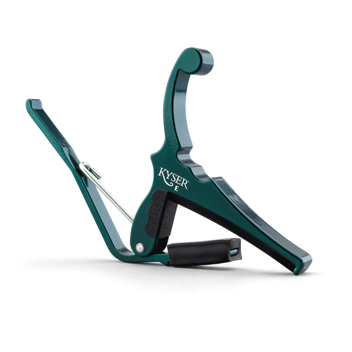 The image shows a Kyser spring-loaded guitar capo with a green anodized aluminum finish. It features a curved clamp, black rubber padding to protect the guitar neck, and a quick-change design for one-handed use. The Kyser logo is visible on the body. This durable, lightweight capo is popular for easily shifting keys on acoustic and electric guitars.