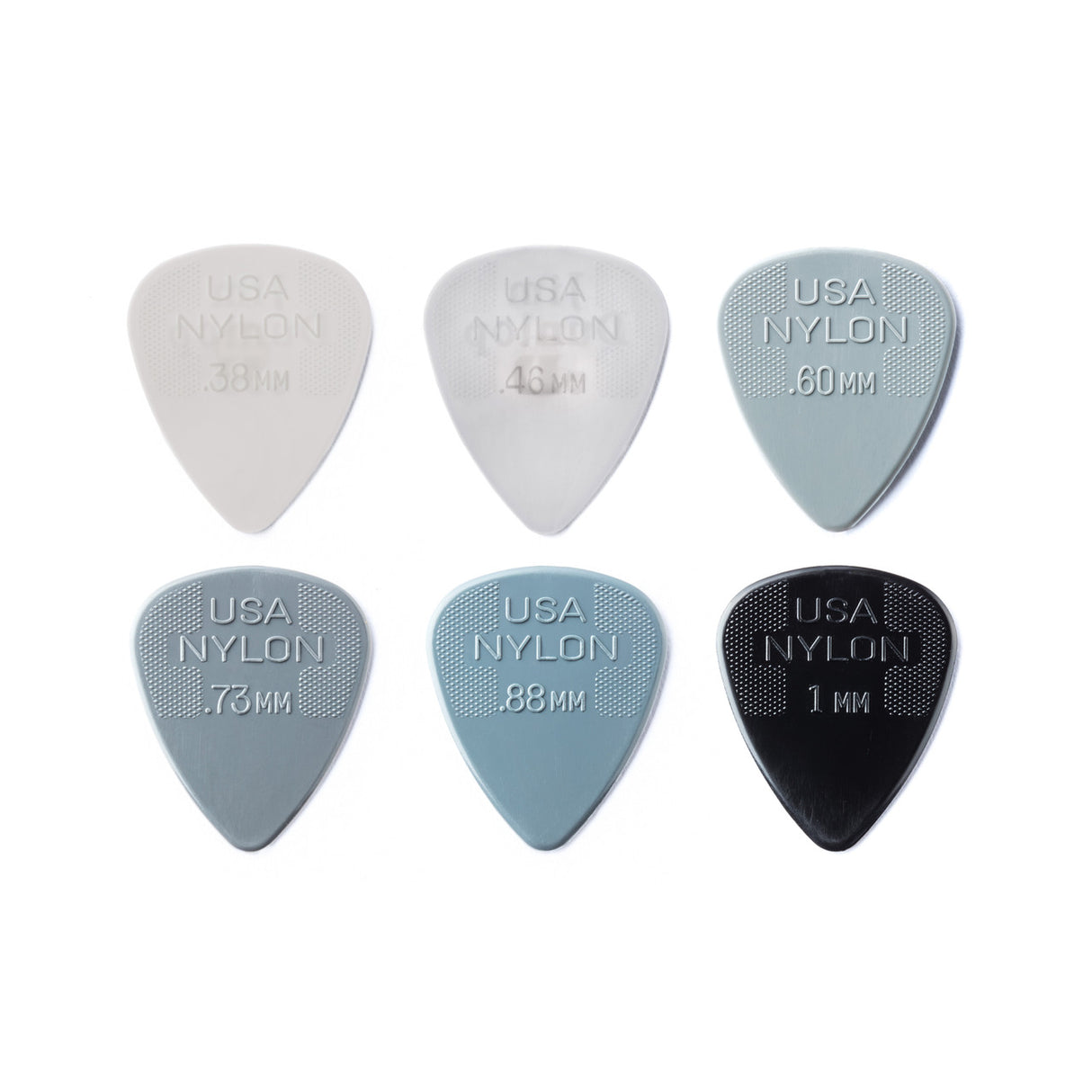 Set of USA Nylon guitar picks in various sizes on a white background