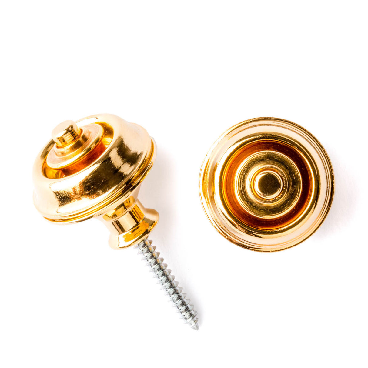A pair of guitar straplocks with a gold finish on a white background