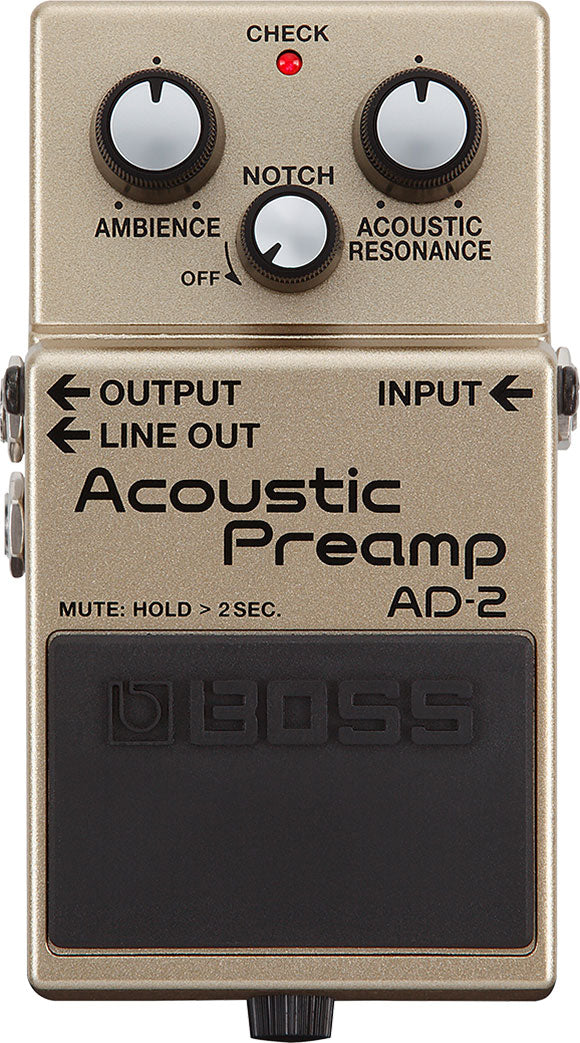 The image shows a Boss AD-2 Acoustic Preamp pedal for acoustic guitars. It features three control knobs: Ambience, Notch, and Acoustic Resonance. There is a red "CHECK" LED, labeled OUTPUT, INPUT, and LINE OUT jacks, and a large black footswitch with the Boss logo and "MUTE: HOLD > 2SEC" text. The pedal is champagne-colored and enhances acoustic tone with effects, feedback control, and resonance.