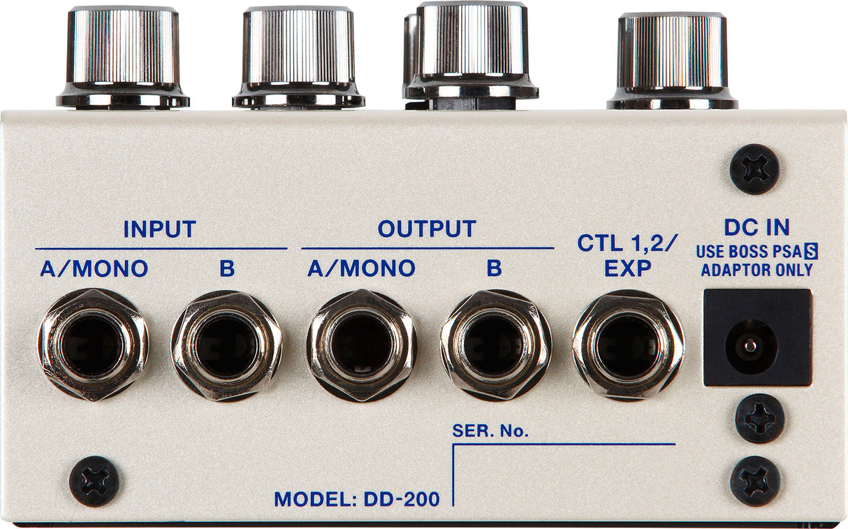 The image shows a Model DD-200 guitar effects pedal, a digital delay unit. It features four chrome control knobs, stereo A/MONO and B input/output jacks, CTL 1,2/EXP jack for external control, and a DC IN power jack. The pedal has a white/cream metal enclosure with blue labeling, designed for advanced delay effects with extensive parameter control and professional build quality.