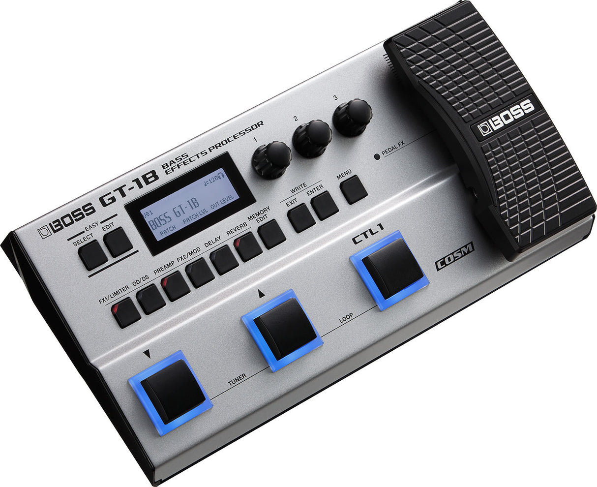 The image shows a BOSS GT-1B Bass Effects Processor, a compact multi-effects pedal for bass guitars. It features an LCD screen, three rotary knobs, multiple function buttons, three footswitches, and an expression pedal. It offers distortion, modulation, delay, reverb effects, a built-in tuner, loop function, patch memory, and COSM technology for versatile bass sound shaping.