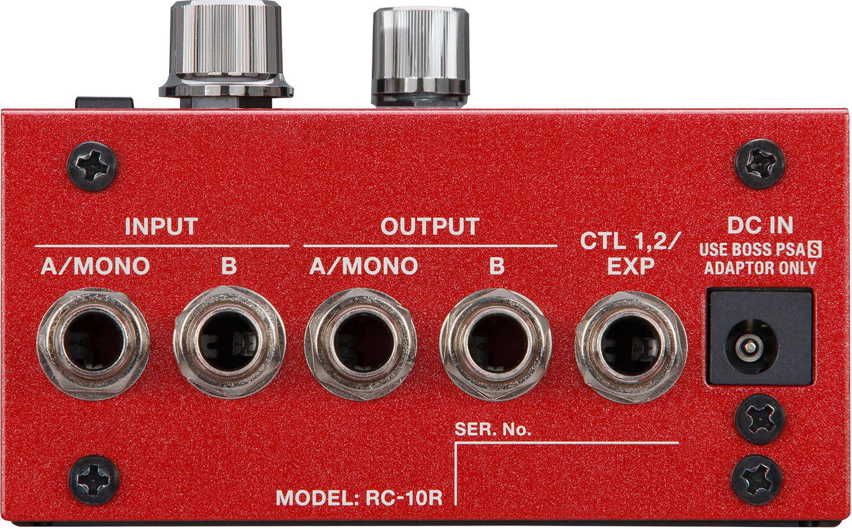 The image shows a BOSS RC-10R loop station or rhythm machine with a bright red metal chassis. It features stereo input/output jacks labeled "A/MONO" and "B," an expression pedal/CTL input, and a DC power input for a BOSS PSA adapter. The top has two control knobs, multiple Phillips screws, a serial number field, and professional 1/4" jacks, designed for advanced looping and playback.