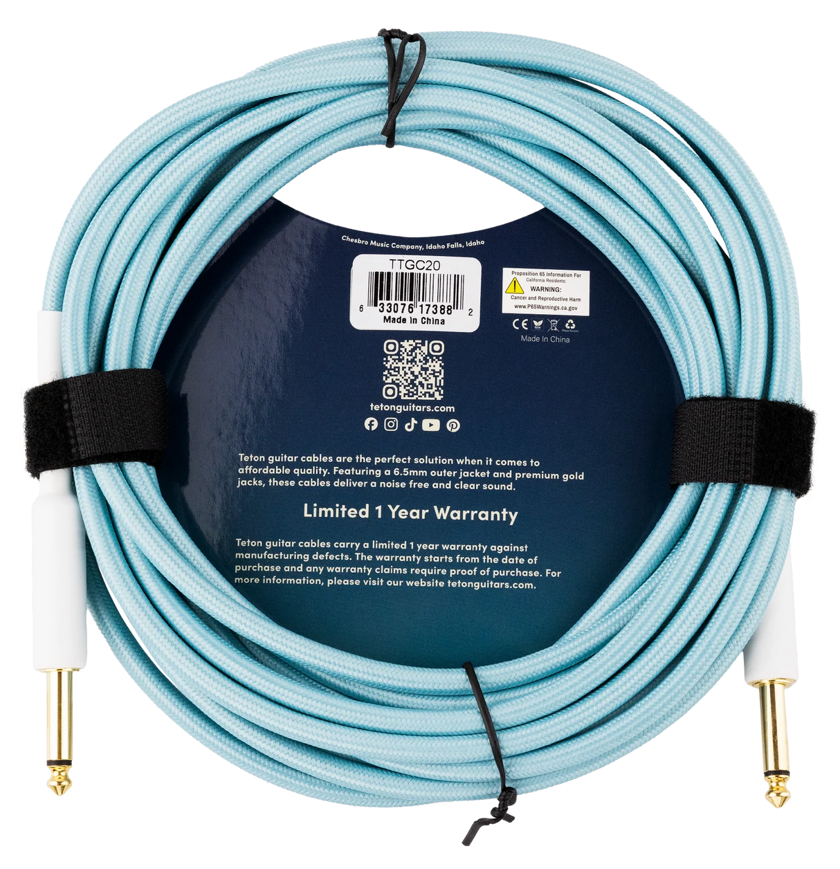 The image shows a light blue Teton guitar cable with fabric braiding and gold-plated 1/4" connectors. It features a durable 6.5mm outer jacket for noise-free, clear sound. Made by Teton (Cheshire Music, Idaho) in China, model TGC20, it comes packaged with a dark blue wrapper, QR code, social media icons, CE certification, and a 1-year warranty.