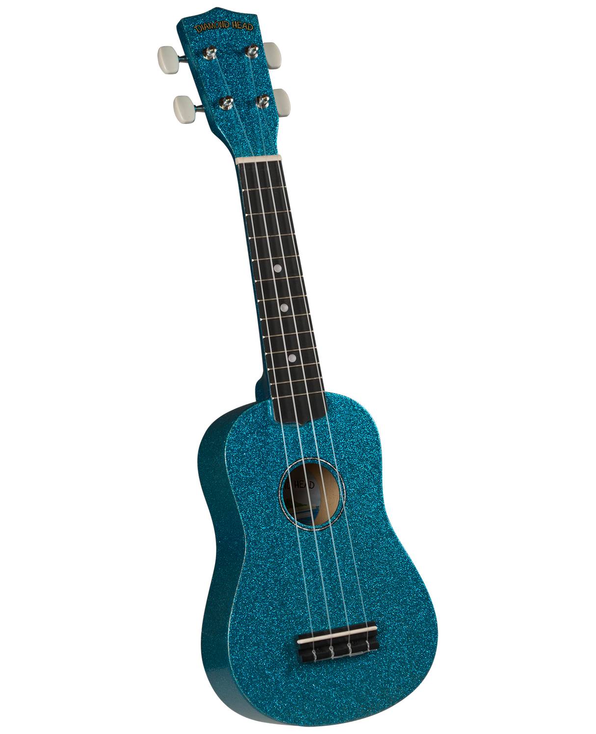 The image shows a striking turquoise blue, sparkly Diamond Head ukulele with four strings, white tuning pegs, and a dark wooden fretboard with dot markers. It has a traditional small guitar-like body with a central sound hole and a bridge at the bottom. This soprano or concert-sized ukulele is visually appealing and represents the classic Hawaiian string instrument known for its melodic sound and portability.