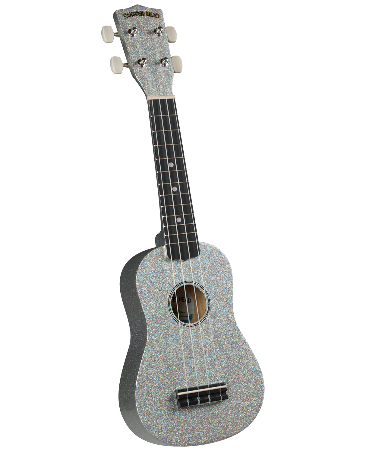 The image shows a soprano ukulele with a sparkly silver finish on the body and headstock. It has four strings, four tuning pegs with cream-colored buttons, a dark wooden fretboard with dot markers, and a traditional body shape with a central sound hole. The headstock features the "Diamond Head" logo. This decorative ukulele is likely an entry to mid-level model from a well-known Hawaiian brand.
