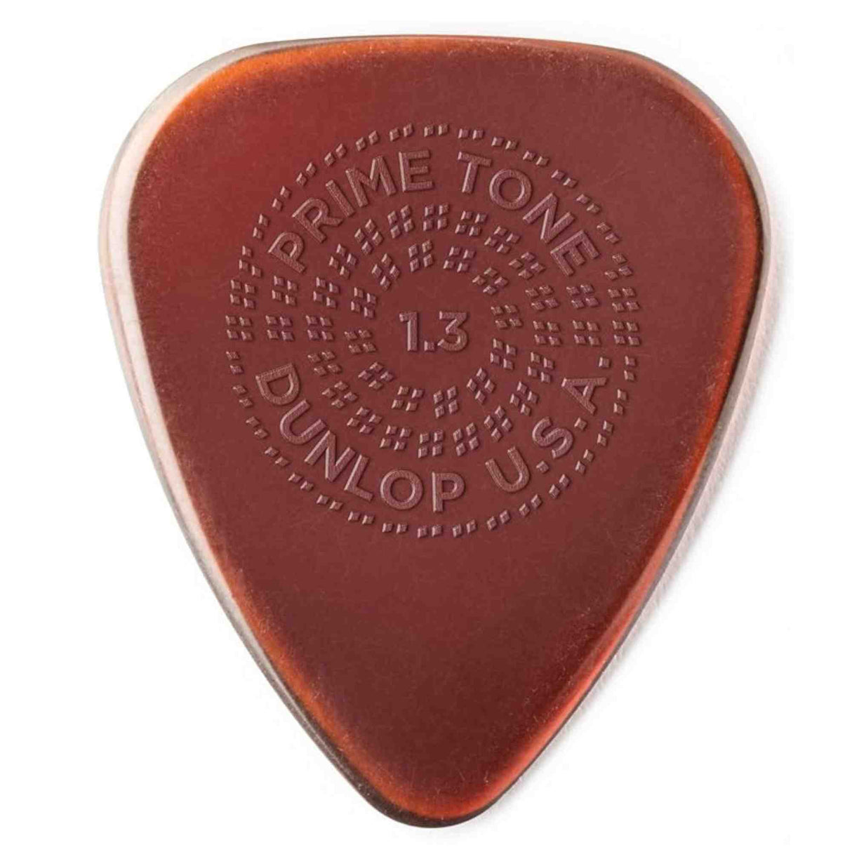 The image shows a Dunlop Primetone guitar pick, 1.3mm thick, in amber/tortoiseshell color. It features embossed circular text: "PRIME TONE" at the top, "1.3" in the center, "DUNLOP" at the bottom, and "U.S.A." on the side. Known for its smooth surface, durable build, and textured grip, this medium-heavy pick offers control and comfort, popular among guitarists across various genres.