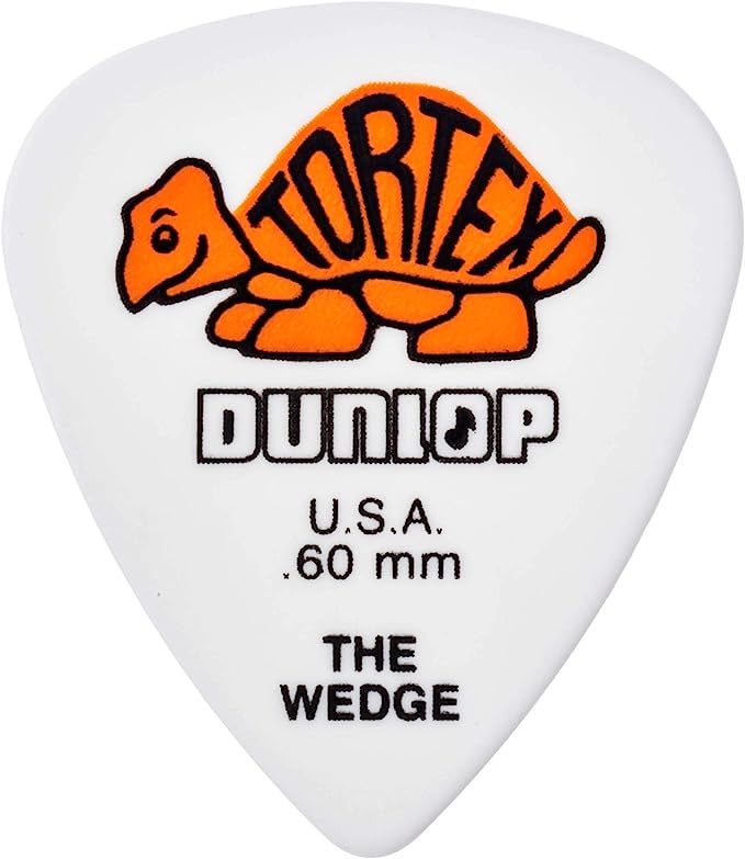 The image shows a white Dunlop guitar pick, "The Wedge" model, featuring the orange Tortex turtle logo. It displays the brand name "DUNLOP," "U.S.A.," the thickness ".60 mm," and the model name "THE WEDGE." This medium-light .60mm pick, made of Tortex material, offers a wedge shape for improved grip and tone, suitable for various guitar playing styles.