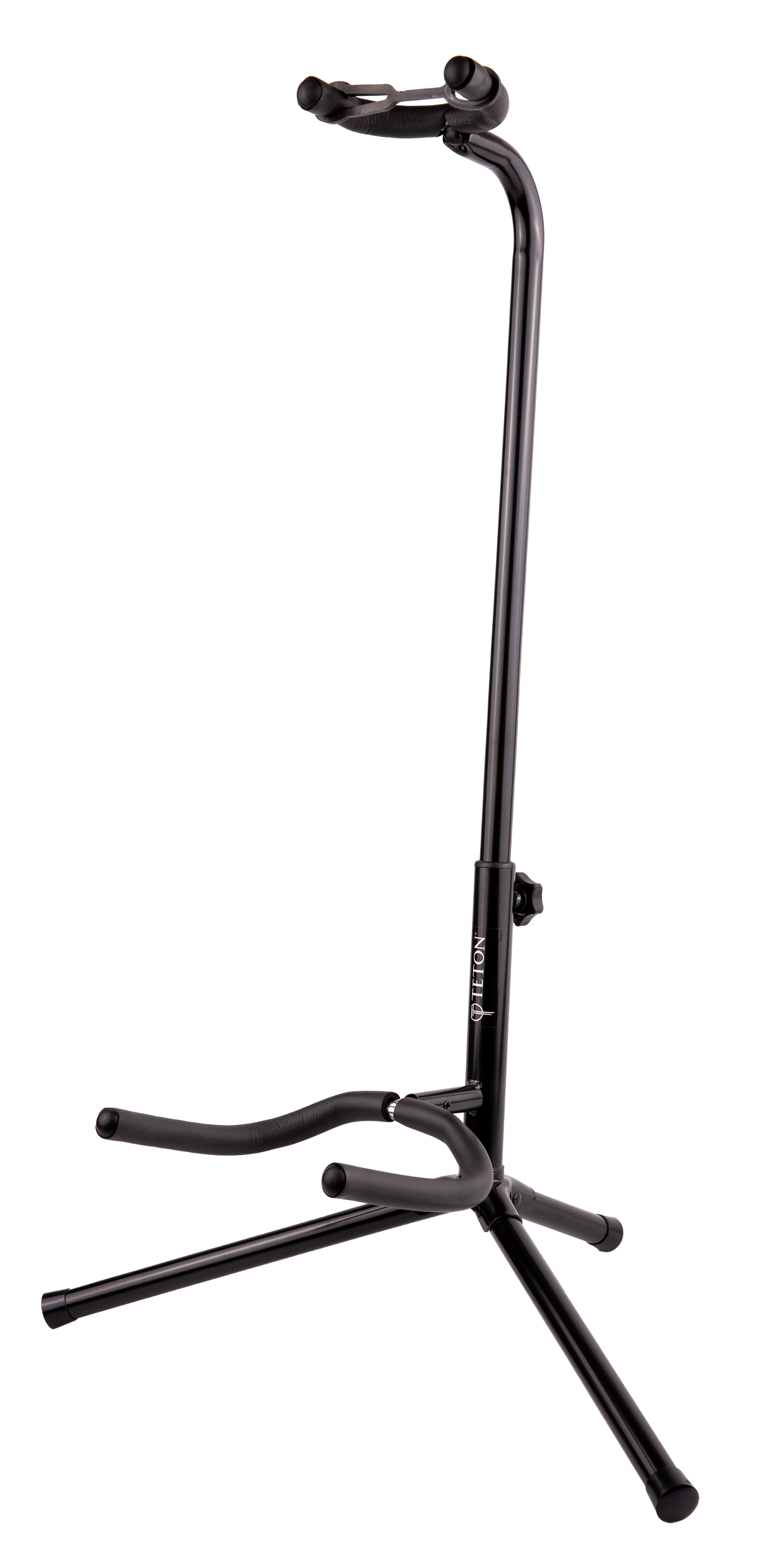 The image shows a black TETON guitar stand with a tripod base and adjustable vertical pole. It has padded curved yokes to cradle the guitar’s body and a lower support arm for the guitar’s bottom. Designed for acoustic or electric guitars, the stand offers stable, secure storage and protection from scratches, making it ideal for home, studio, or stage use.