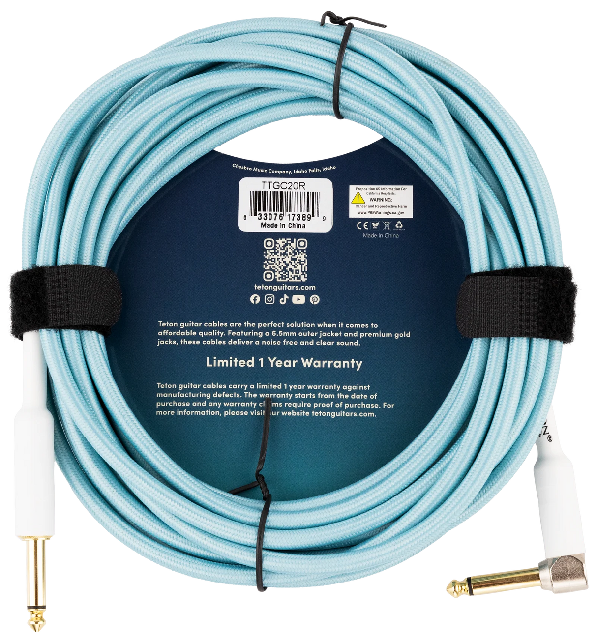 The image shows a light blue Teton guitar cable (model TTGC20R) with fabric braiding and gold-plated 1/4" connectors made by Chesebro Music Company, Idaho Falls. It features a durable 6.5mm jacket, premium gold jacks for clear, noise-free sound, professional-grade build, a 1-year limited warranty, Teton branding, a QR code, and links to tetonguitars.com and social media.
