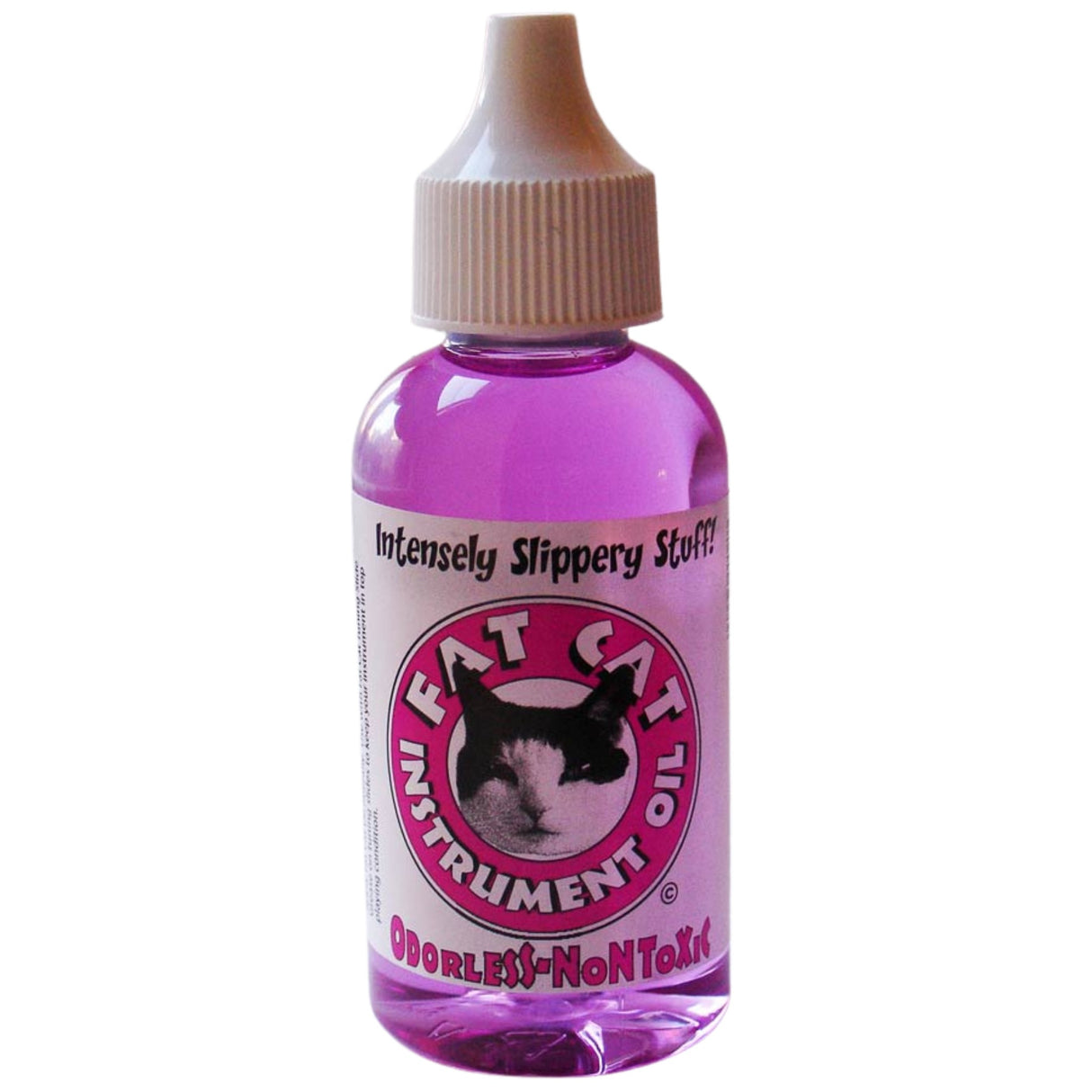 The image shows a small dropper bottle of "Fat Cat Instrument" slide lubricant for brass instruments. Labeled "Intensely Slippery Stuff!" and described as "Odorless-NonToxic," it contains purple liquid. The pink circular label features the Fat Cat logo with a black and white cat. This specialized lubricant helps trombonists and brass players keep instrument slides moving smoothly.