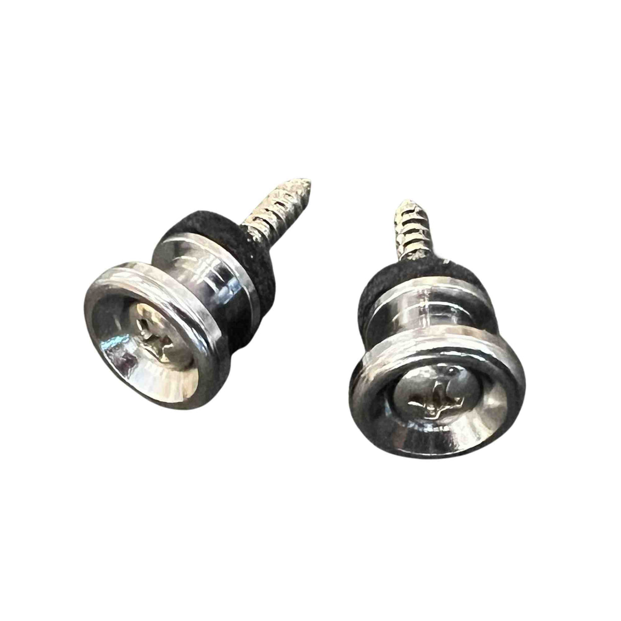 The image shows two guitar strap locks, essential accessories that securely attach a strap to a guitar and prevent slipping. Each lock has a threaded screw installed in the guitar body and a clear locking mechanism with internal springs. The chrome or nickel-plated locks click onto the screw button and release by pressing the mechanism, offering more security than standard strap buttons, ideal for valuable instruments and energetic play.