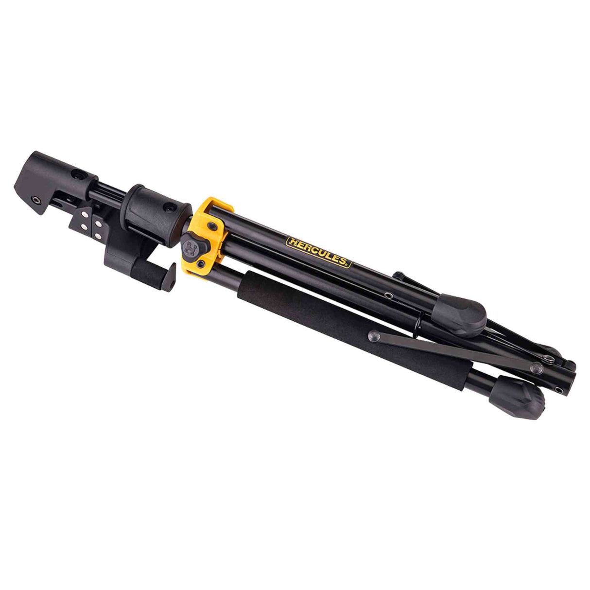 The image shows a folded Hercules microphone boom stand with black telescoping tubes and yellow/gold adjustment joints. The "HERCULES" branding is visible on one tube. It features a folding tripod base, boom arm attachment, and multiple adjustment knobs. This professional-grade, portable stand is commonly used in studios and live venues for reliable microphone support.