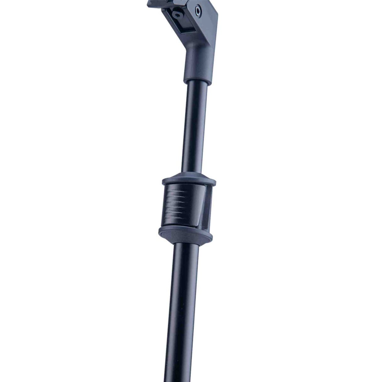 The image shows the upper portion of a microphone stand with a black metal telescoping boom arm, an adjustable ribbed clutch for height changes, and a partially visible mounting clip to hold a microphone. This professional-grade stand is commonly used in studios and live settings to securely position microphones at various heights and angles for vocalists, musicians, and audio engineers.