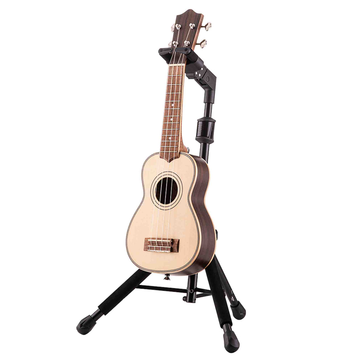The image shows a soprano or concert-sized ukulele on a black adjustable guitar stand. It has a light spruce top, darker wood back and sides, a traditional sound hole with decorative rosette, four strings, chrome tuning pegs, and a rosewood fretboard with position markers. The well-crafted instrument features clean binding and a professional finish, indicating quality construction.