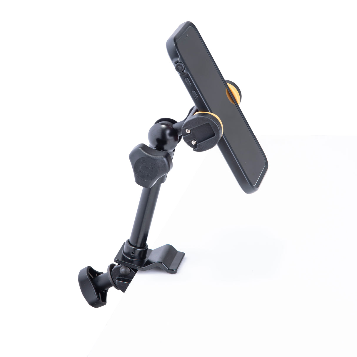 A cellphone holder mounted on a white desk