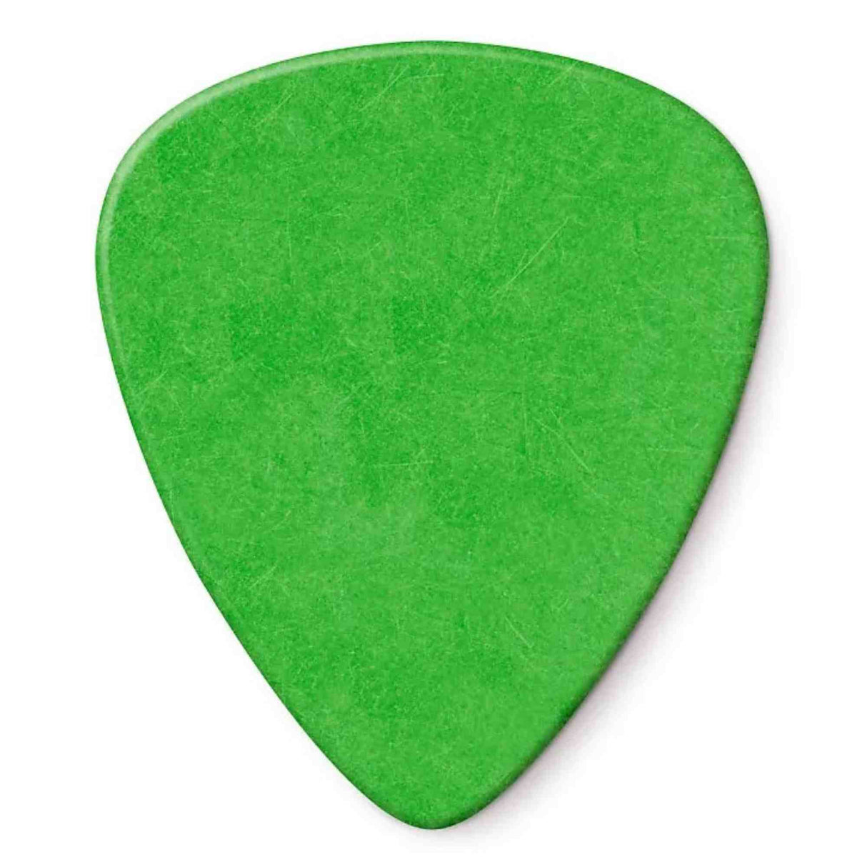 The image shows a bright green, teardrop-shaped guitar pick with visible scratches and wear from use. Made of plastic, it is a common accessory used to strum or pluck guitar strings. Guitar picks help produce clearer sound and protect the player's fingernails during playing.