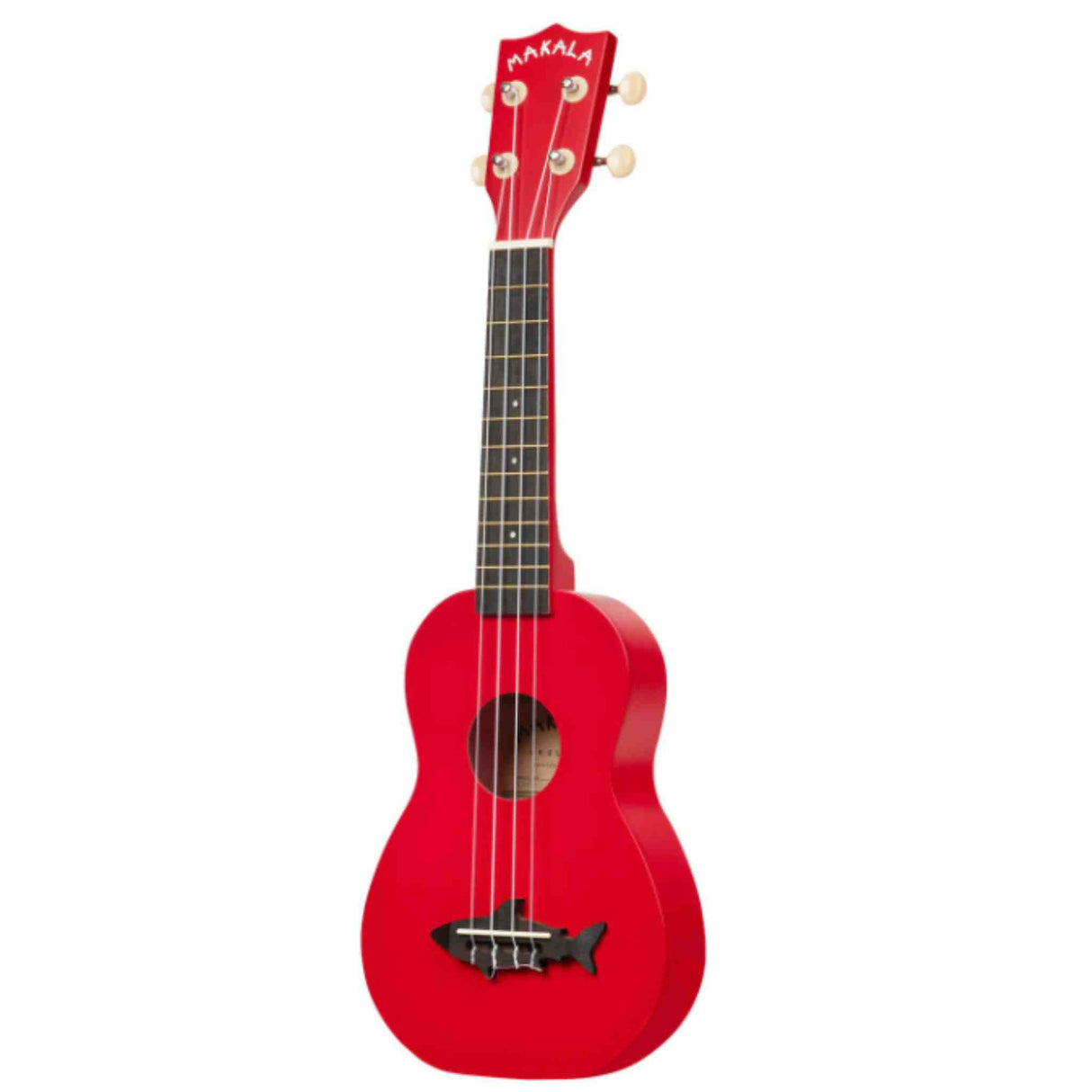The image shows a red Makala ukulele with a small guitar-like body, four strings, and four cream-colored tuning pegs. It features a dark fretboard with fret markers, a round sound hole, and a small fish-shaped design near the bridge. The vibrant red finish covers the body and headstock, making it a visually striking instrument suitable for beginners and experienced players alike.