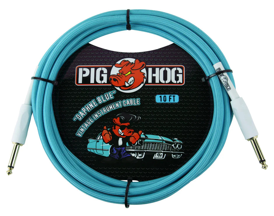 The image shows a Pig Hog 10-foot "Daphne Blue" vintage instrument cable with 1/4" connectors. The turquoise cable features the Pig Hog mascot, a red cartoon pig, on its packaging alongside a vintage-style car, reflecting the brand's retro vibe. This quality cable is used to connect electric guitars, basses, and other instruments to amps, pedals, or audio interfaces.