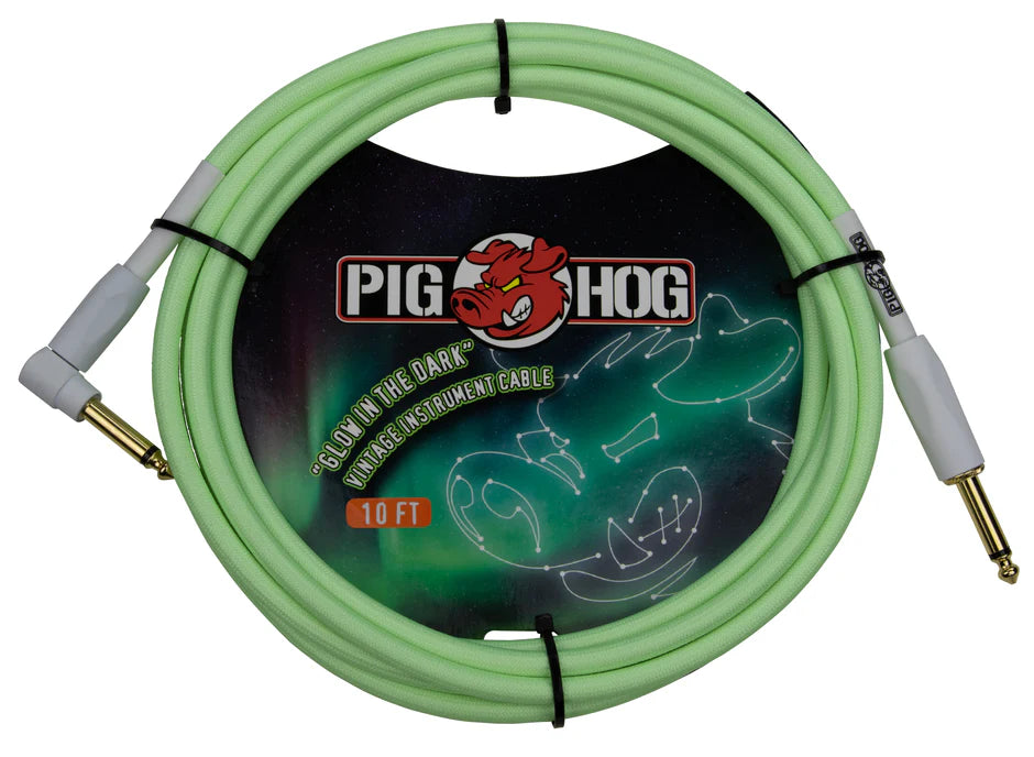 The image shows a Pig Hog 10-foot "Glow in the Dark" instrument cable with a seafoam green jacket that glows in low light. It features gold-plated 1/4" phone plugs with gray housings on both ends. Designed for guitars, basses, and keyboards, the cable is durable and reliable. It is coiled in packaging displaying the Pig Hog logo and their red pig mascot, highlighting the glow-in-the-dark feature.