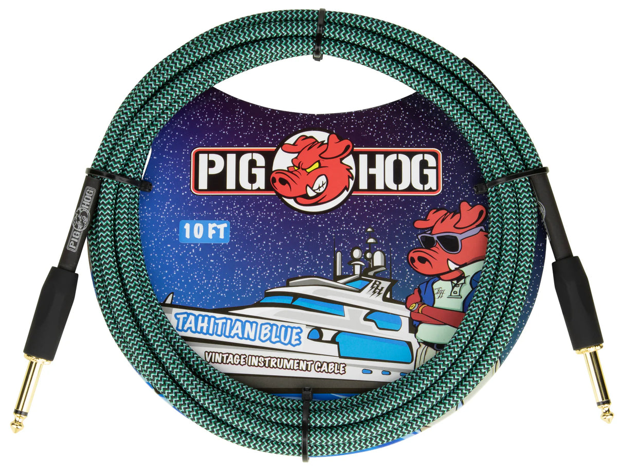 The image shows a Pig Hog "Tahitian Blue" vintage 10-foot instrument cable with a turquoise and black woven chevron pattern. It has gold-plated 1/4" connectors with black strain reliefs. The packaging features Pig Hog’s red pig mascot and nautical artwork, including a yacht and a pig wearing sunglasses. Designed for guitars, basses, and keyboards, it combines durability with a stylish, maritime-inspired look.