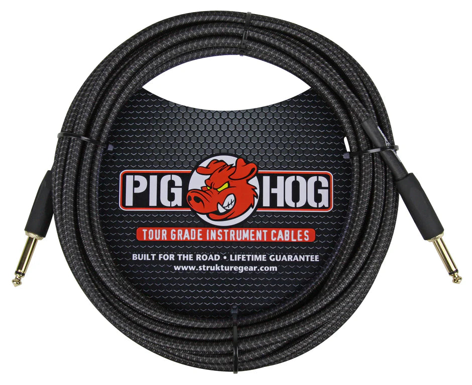 The image shows a Pig Hog tour-grade instrument cable with a durable black braided jacket and gold-plated 1/4" TS connectors. Featuring the red Pig Hog pig logo, it is labeled "Built for the Road" with a lifetime guarantee. Designed for electric guitars, basses, and electronic instruments, this professional-quality cable is made to endure live performance and heavy use. The brand's website, www.strukturegear.com, is also visible.