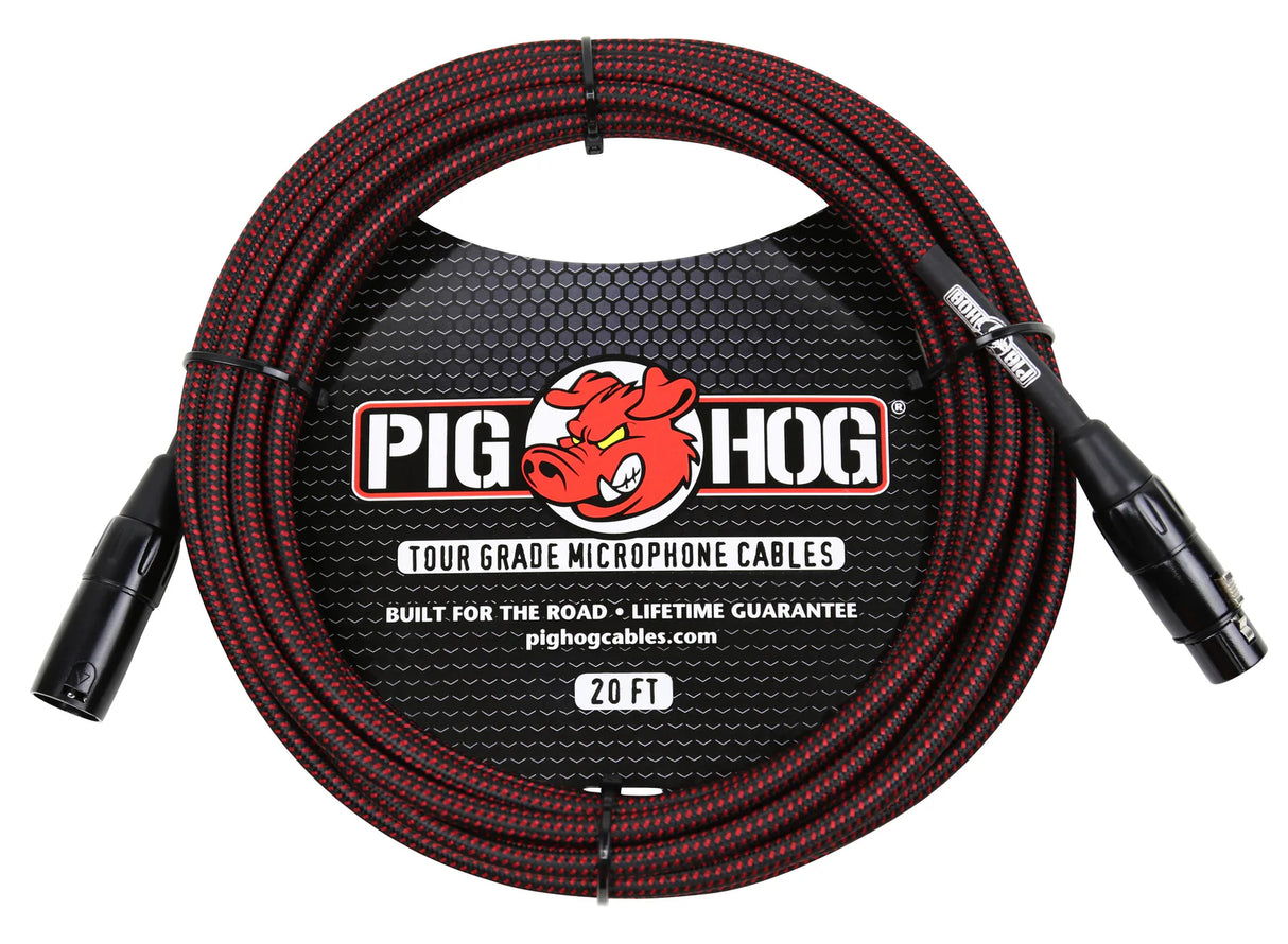 The image shows a Pig Hog tour-grade 20-foot XLR microphone cable with black and red braided exterior. It features male and female XLR connectors, Pig Hog branding with a red pig logo, and text highlighting its durability, "Built for the Road" and "Lifetime Guarantee." Designed for professional audio use, it is made to withstand heavy-duty use in live performances and frequent setups.