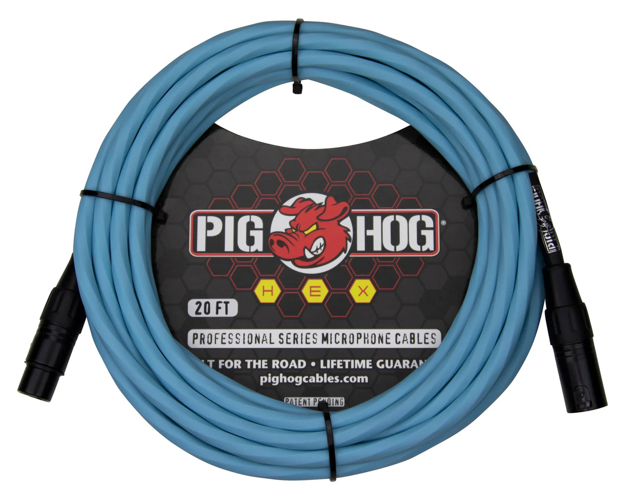 The image shows a 20-foot Pig Hog Professional Series XLR microphone cable with black connectors and a light blue/turquoise cable. The packaging features the Pig Hog logo with a red cartoon hog and highlights its durability for "the road" with a lifetime guarantee. This high-quality cable is designed for professional music use, connecting microphones to audio equipment for live or studio settings.
