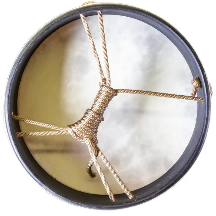 Close-up of the back of a hand drum with a white background