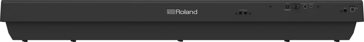 The image shows a full-size Roland digital piano with a sleek black finish and the prominent Roland logo on the front panel. It features weighted keys, suggesting a professional or semi-professional model designed to replicate an acoustic piano's feel. Known for quality sounds and versatile features, this modern instrument suits both home and professional music settings.