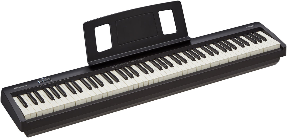 The image shows a sleek, black Roland digital piano with 88 full-sized keys in a traditional layout. It features a built-in music stand, a small control panel on the left, and the Roland logo. Designed with a minimalist, professional look, this portable digital piano is ideal for musicians seeking the feel of an acoustic piano with digital versatility for both practice and performance.