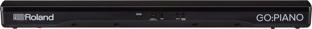 The image shows the back panel of a Roland GO:PIANO digital piano, a sleek black portable keyboard from Roland's GO series. Visible are the Roland logo, "GO:PIANO" branding, and various input/output ports for connecting to devices, power, and audio equipment. This model offers an affordable, compact solution with authentic piano sounds for beginners and musicians on the go.
